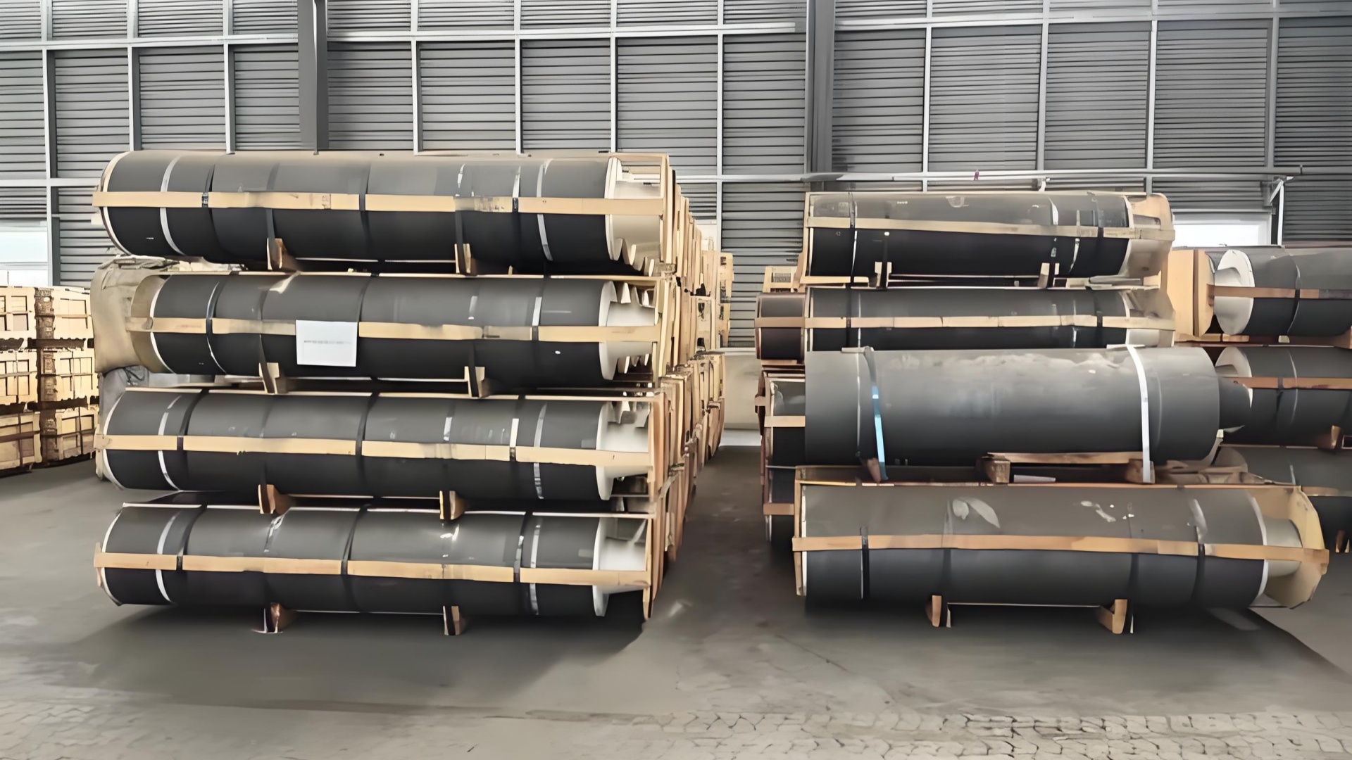 Final inspection and packing of graphite electrodes for safe export.