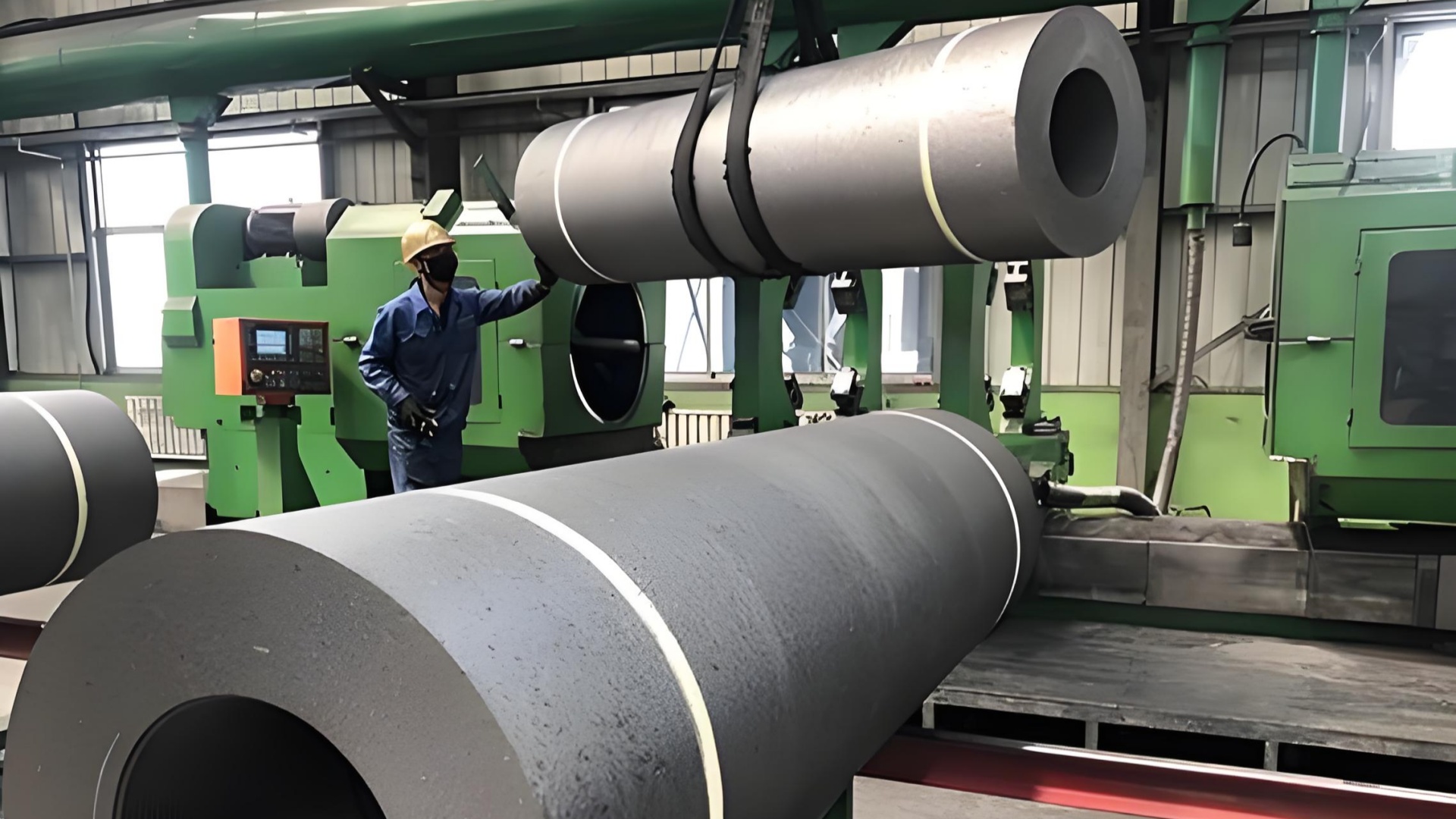 High-tech carbon materials manufacturing plant showcasing graphite electrode machining, quality control, and export-ready facilities.